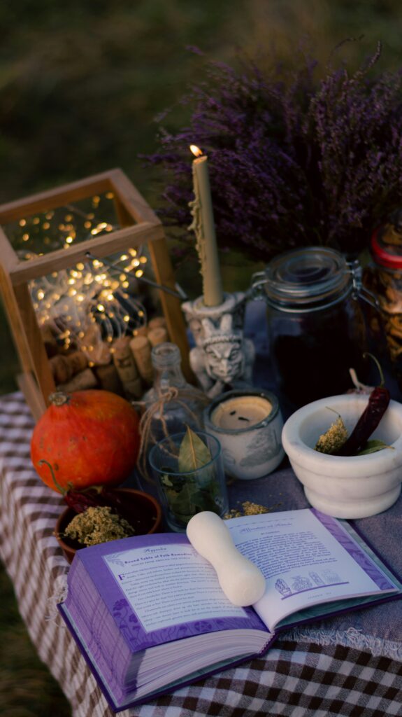 Flat lay photo of healing herbs, glass bottles, and a mortar and pestle on a rustic wood background representing holistic gut health.