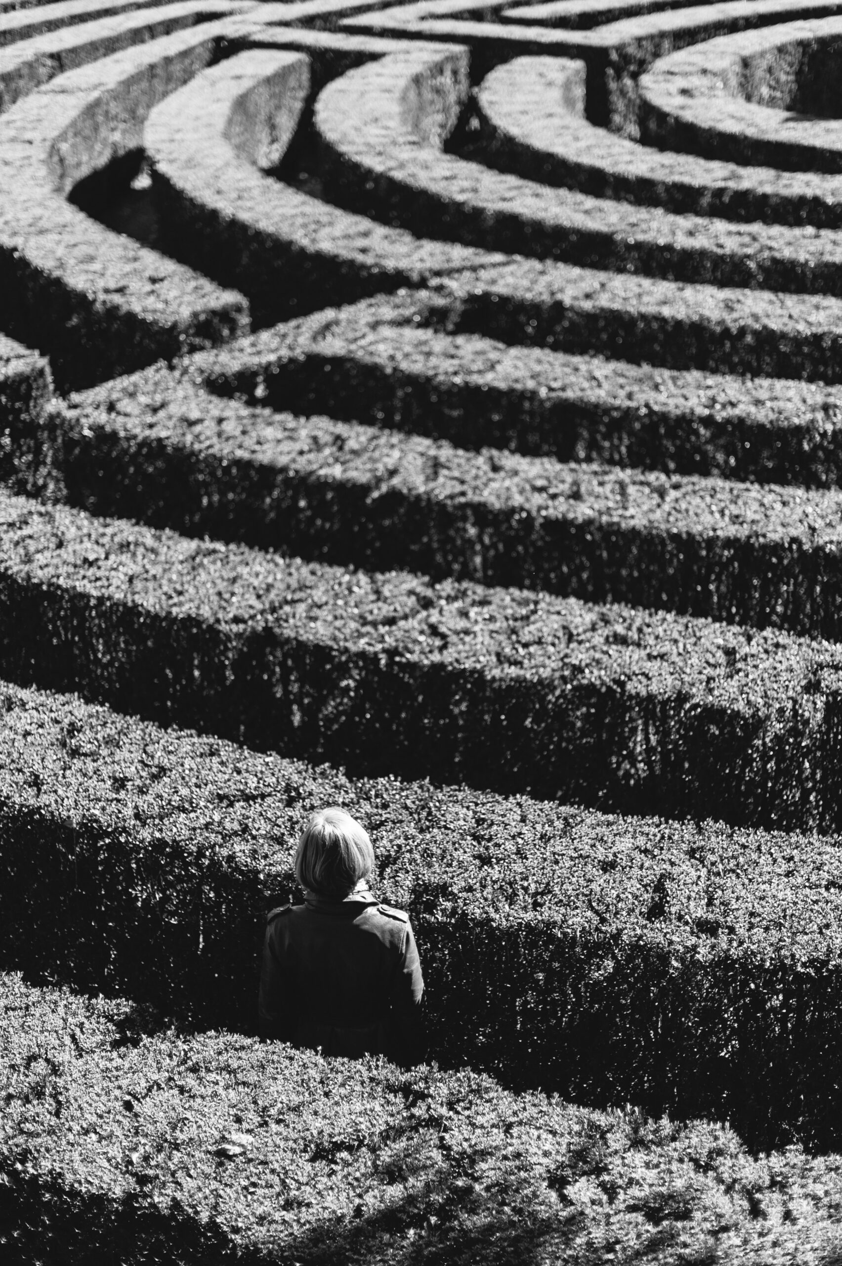 Patient sitting in a maze looking uncertain, representing misdiagnosis and nervous system trauma