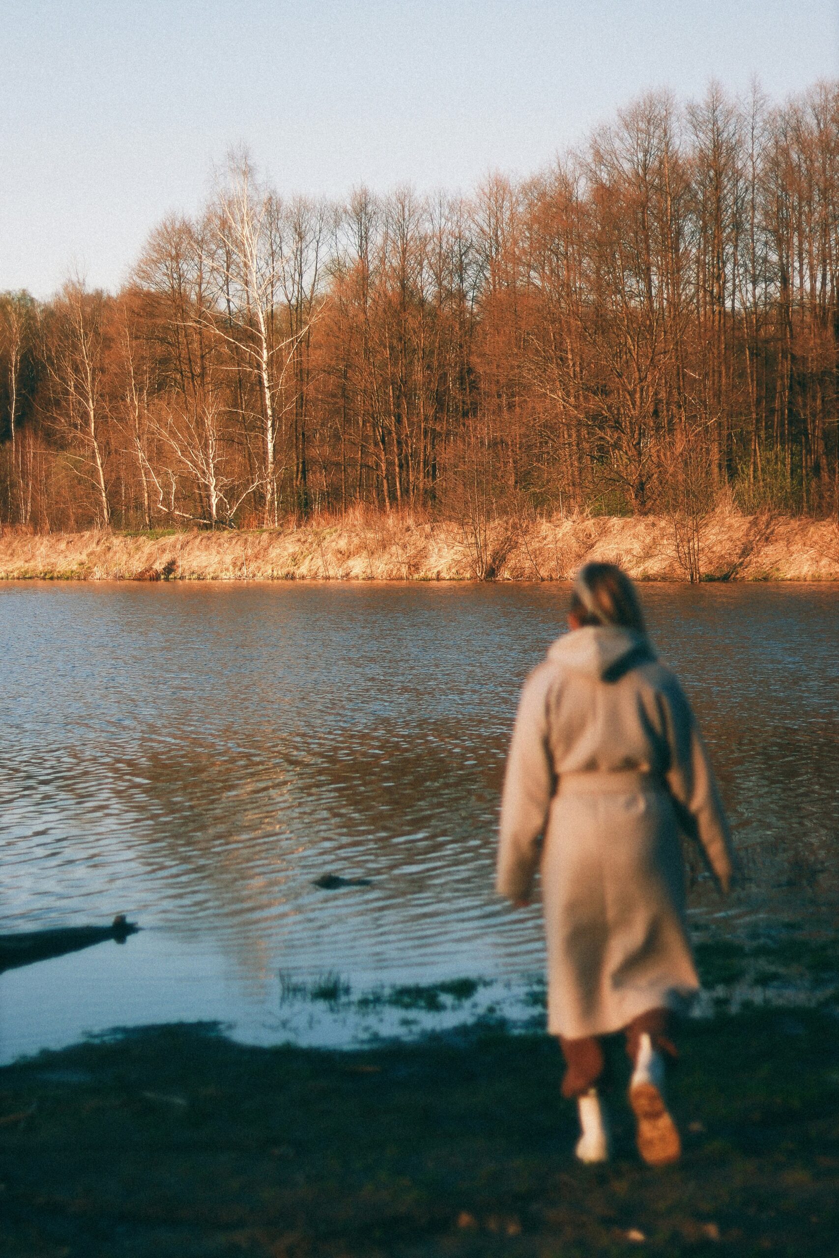 Woman overwhelmed at lake representing ADHD in women and executive dysfunction