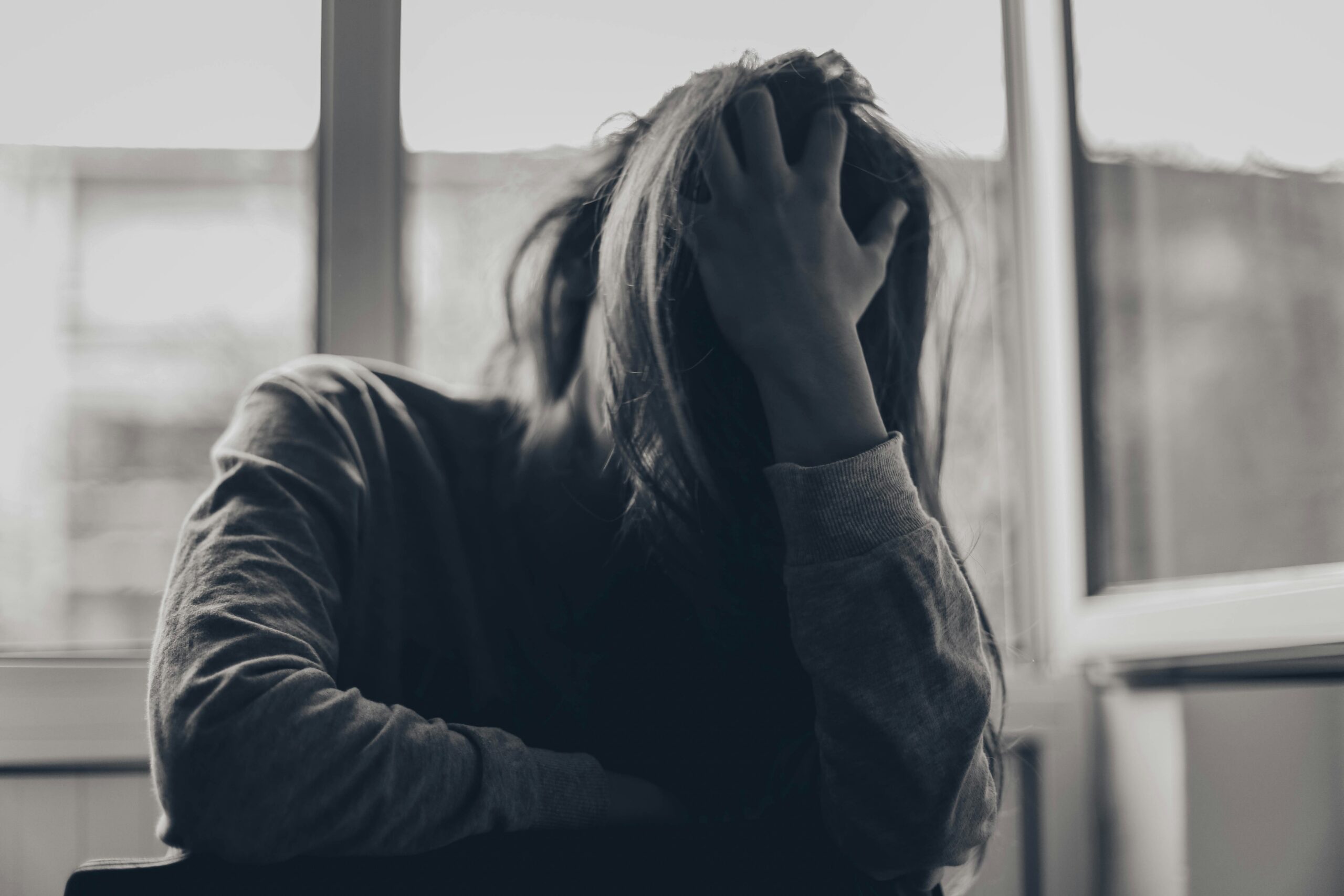Woman experiencing symptoms of nervous system dysregulation